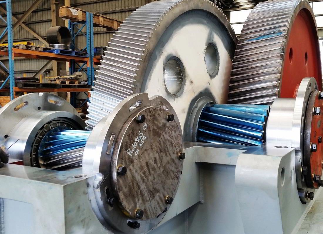 Large machined gear case assembly with twin helical gear sets in the ABC Heavy Engineering workshop