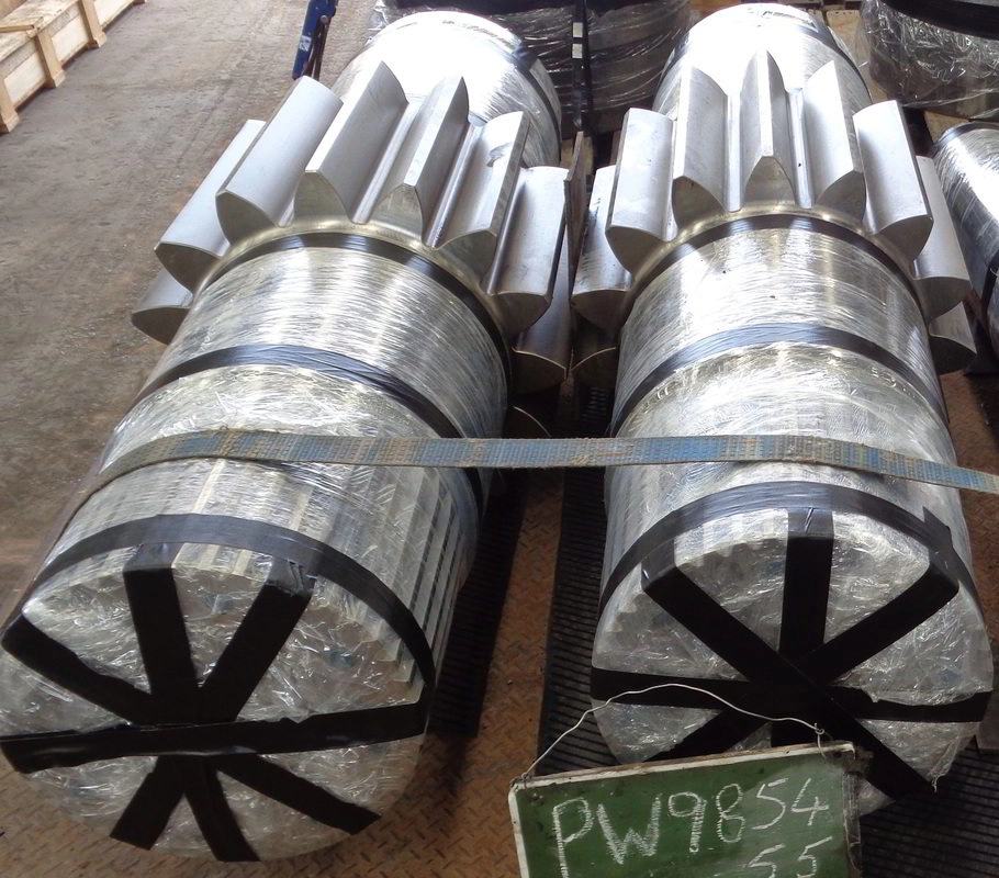 A pair of large machined helical pinion shafts strapped and wrapped for dispatch, tagged PW9854