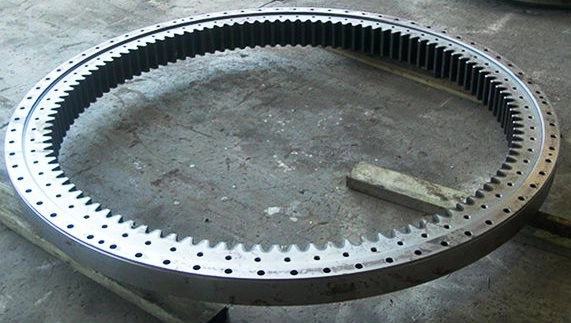 Large diameter slew bearing gear ring laid out on the workshop floor