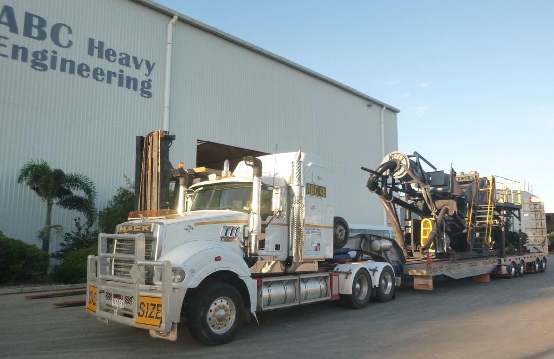 ABC Heavy Engineering Mack prime mover and low loader outside the Paget workshop